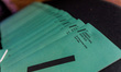 Leaflets with the event logo are on a table in Limassol, Cyprus, on November 23, 2024. The...