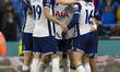 Pedro Porro #23 of Tottenham Hotspur F.C. celebrates his goal with teammates during the Pr...