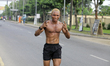 A runner approaches GRA, Ikeja, during the 10-kilometer Capital City Race 2024 in Ikeja, L...