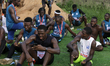 Runners rest after completing the 10-kilometer Capital City Race 2024 in Ikeja, Lagos, Nig...