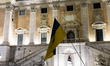 Ukrainian citizens participate in a torchlight procession in Capitol Square to commemorate...