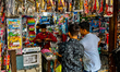 Youth buy toy guns at a shop in the Bhutia Bazaar (Tibetan Market) in Nainital, Uttarakhan...