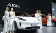 A model stands next to an electric AION HYPTEC HT at the Thailand International Motor Expo...