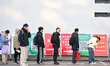 Candidates line up at a test center of Nanjing Forestry University in Nanjing, China, on D...