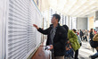 Candidates line up at a test center of Nanjing Forestry University in Nanjing, China, on D...