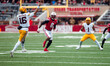 Minnesota quarterback Max Brosmer #16 attempts a pass against the Wisconsin Badgers at Cam...