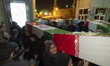 Iranian female mourners carry the coffins containing the remains of unknown martyrs from t...