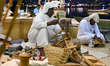 A man makes handicrafts during the 14th Katara Traditional Dhow Festival in Katara Cultura...