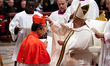 Pope Francis places the biretta upon the head of newly appointed Equatorian Cardinal Luis...