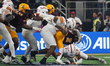 Running back Kyson Brown #2 of Arizona State runs with the ball against Iowa State during...