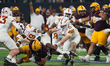 Running back Cam Skattebo #4 of Arizona State runs with the ball against Iowa State during...