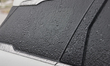 Ice covers a vehicle as freezing rain causes surfaces to be coated with a sheet of ice in...
