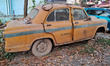 An abandoned iconic yellow Ambassador taxi is seen in Kolkata, India, on December 13, 2024...