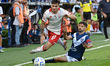Walter Mazzantti, a Huracan player, contests the ball with Agustin Bouzat, a Velez Sarsfie...