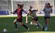 Julia Dorsey #5 of Dallas Trinity FC drives the ball forward against Leah Scarpelli #17 of...