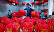 Workers make red lanterns in Handan, China, on December 17, 2024. 
