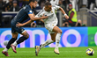 Kylian Mbappe of Real Madrid and Sergio Barreto of CF Pachuca are in action during the FIF...