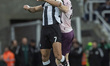 Joelinton of Newcastle United challenges Nathan Collins of Brentford for a header during t...