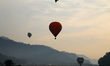 Hot-air balloons take off in Pokhara, Nepal, on December 24, 2024, during the Internationa...