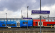 Regional trains, including a Sudostbayernbahn double-deck train, park at Muhldorf/Inn Trai...