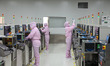 Workers produce automotive semiconductor products at a workshop of an automotive semicondu...