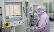 Workers produce automotive semiconductor products at a workshop of an automotive semicondu...