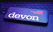 The Devon Energy logo appears on a smartphone screen in this illustration photo in Reno, U...