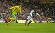 Kenneth Paal of Queens Park Rangers competes for possession with Oscar Schwartau of Norwic...