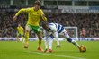 Kenneth Paal of Queens Park Rangers competes for possession with Oscar Schwartau of Norwic...