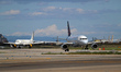 An Airbus A319-111 from Brussels Airlines and a Vueling aircraft are on the runway after l...