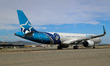 An Airbus A321-271NX from Air Transat, featuring a CF Montreal sticker, is on the runway r...