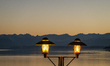 A lantern stands on the lakeshore promenade at Lake Starnberg in Starnberg, Bavaria, Upper...