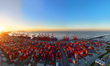 The sun rises over the East China Sea at Yangshan Deep Water Port in Shanghai, China, on J...