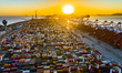 The sun rises over the East China Sea at Yangshan Deep Water Port in Shanghai, China, on J...