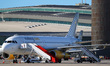 An Airbus A320-232 from Vueling is parked, waiting for passengers to board at Barcelona ai...