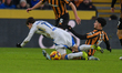 Hull City's Steven Alzate tackles Leeds United's Brenden Aaronson during the Sky Bet Champ...