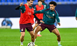 Vitinha and Warren Zaire-Emery of Paris Saint-Germain attend a training session ahead of t...