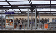 A traveler stands on the platform at Starnberg Station, which is under scaffolding, in Sta...