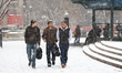 People walk through Union Square as the snow becomes heavy in New York, N.Y., on January 6...
