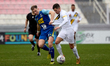 Stefan Ilici of Zabbar St. Patrick is challenged by Adam Magri Overend of Sliema Wanderers...