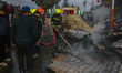 Firefighters work to extinguish a fire on residential houses in Srinagar, Jammu and Kashmi...