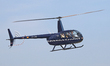 A Robinson R-44 from a private company lands at Sabadell Airport in Sabadell, Spain, on De...