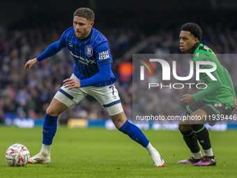 Lino Sousa of Bristol Rovers puts pressure on Wes Burns of Ipswich Town during the Emirates FA Cup Third Round match between Ipswich Town an... by MI News/NurPhoto