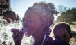 The San woman smoking wooden pipe in the Living Museum of the Ju’Hoansi-San, Grashoek, Nam...