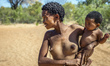San woman with her child in the Living Museum of the Ju’Hoansi-San, Grashoek, Namibia 