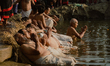Devotees perform a religious ritual on the first day of Shree Swasthani Brata Katha, a mon...