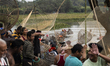 Villagers participate in a community fishing event on the occasion of the Bhogali Bihu fes...