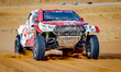 Guoyu Zhang and Yicheng Wang drive their Toyota Hilux during the Dakar Rally in Saudi Arab...