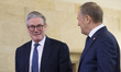 Polish Prime Minister Donald Tusk (R) welcomes Britain's Prime Minister Keir Starmer (L) a...