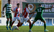 Camilo Andres Sanchez Gonzales of Melita vies for the ball with Dunstan Vella of Floriana...